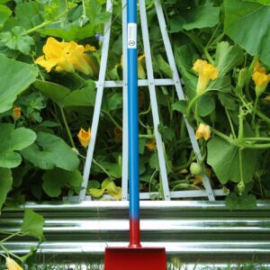 Colorful garden tool in front of plants.