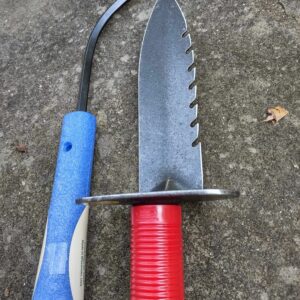 Garden tools on concrete surface.