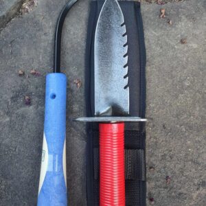 Garden tools on a stone surface.