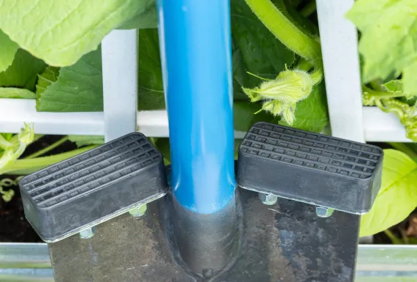 Spade with blue handle and step plates