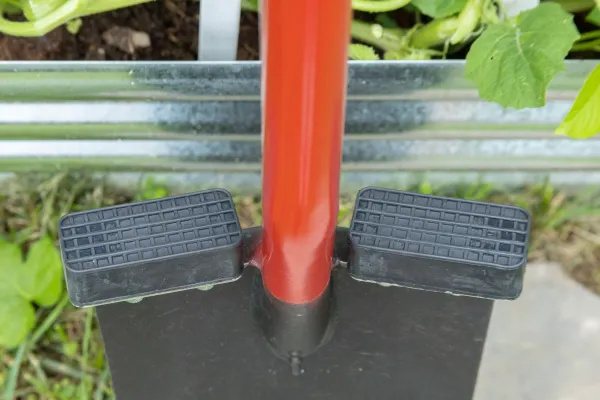 Garden spade with red shaft and textured footrests