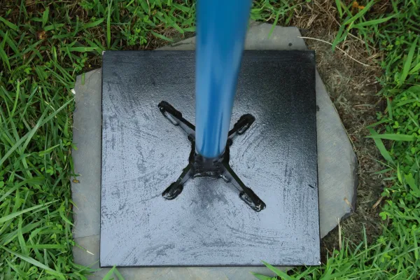 Blue pole mounted on black metal plate